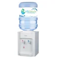 Hot and room temperature water dispenser with table-top design and a 20L water bottle on top.